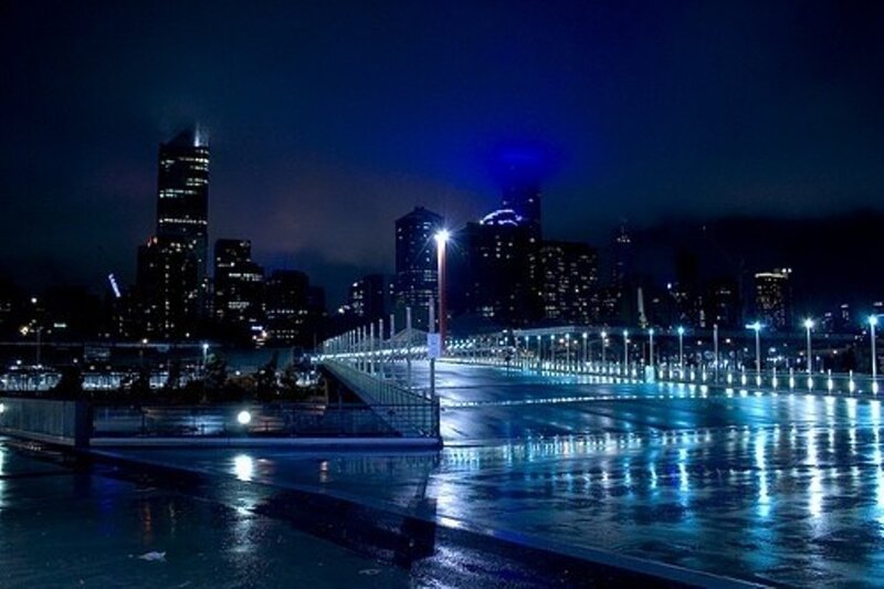 nighttime cityscape with wet pavement