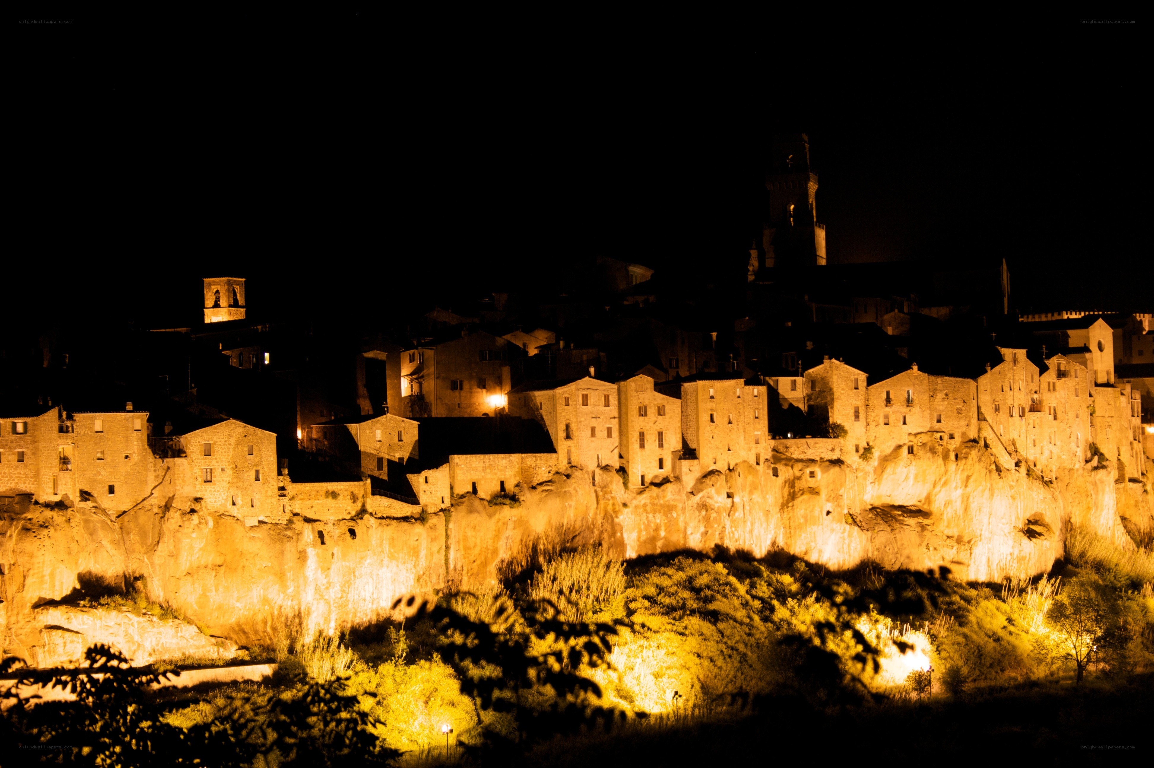 nighttime cliffside village