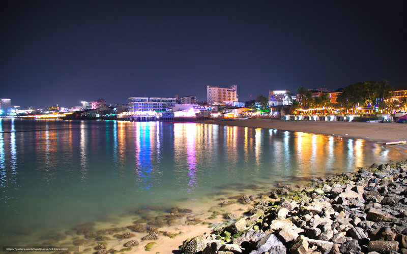nighttime coastal city lights