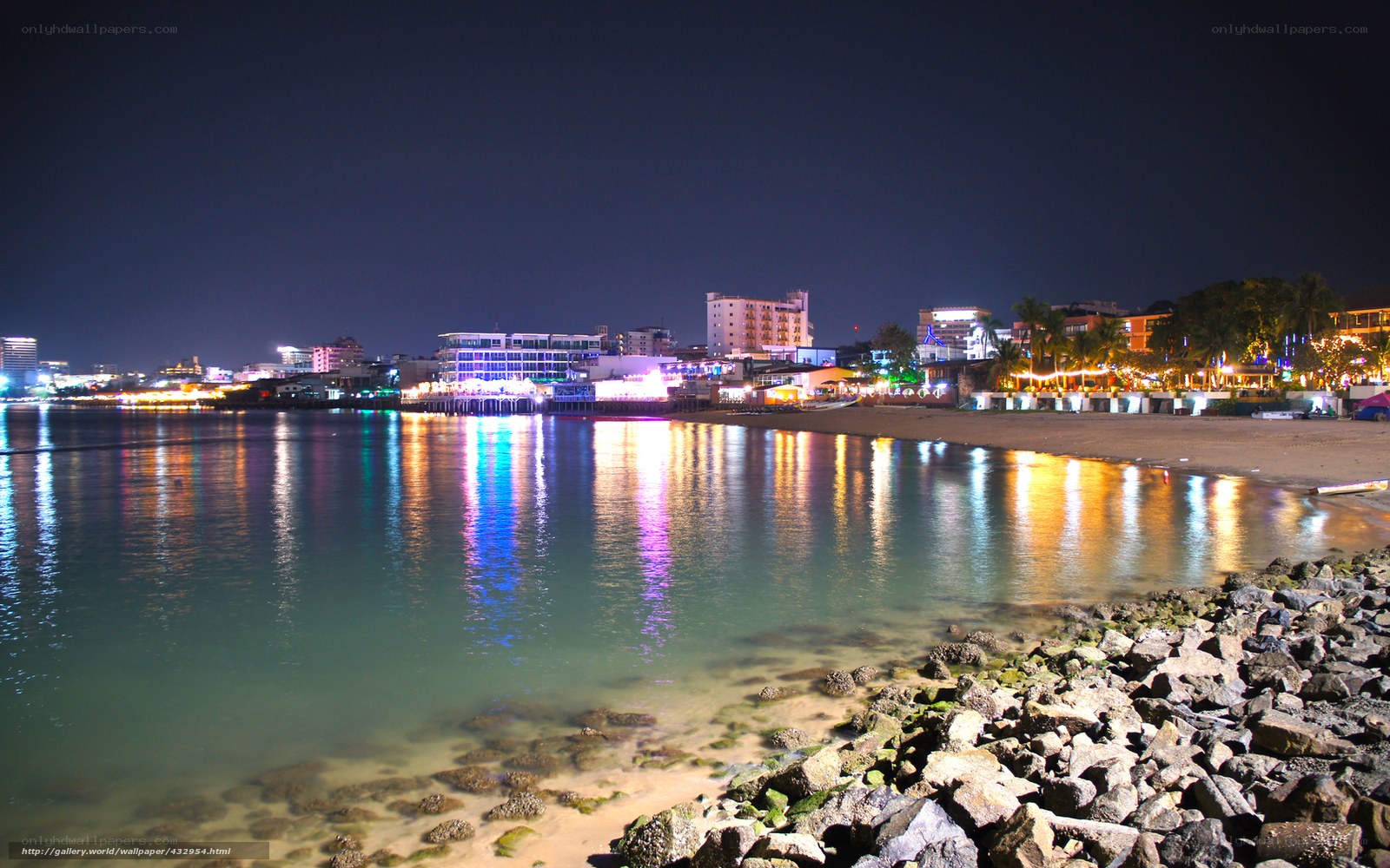 nighttime coastal city lights