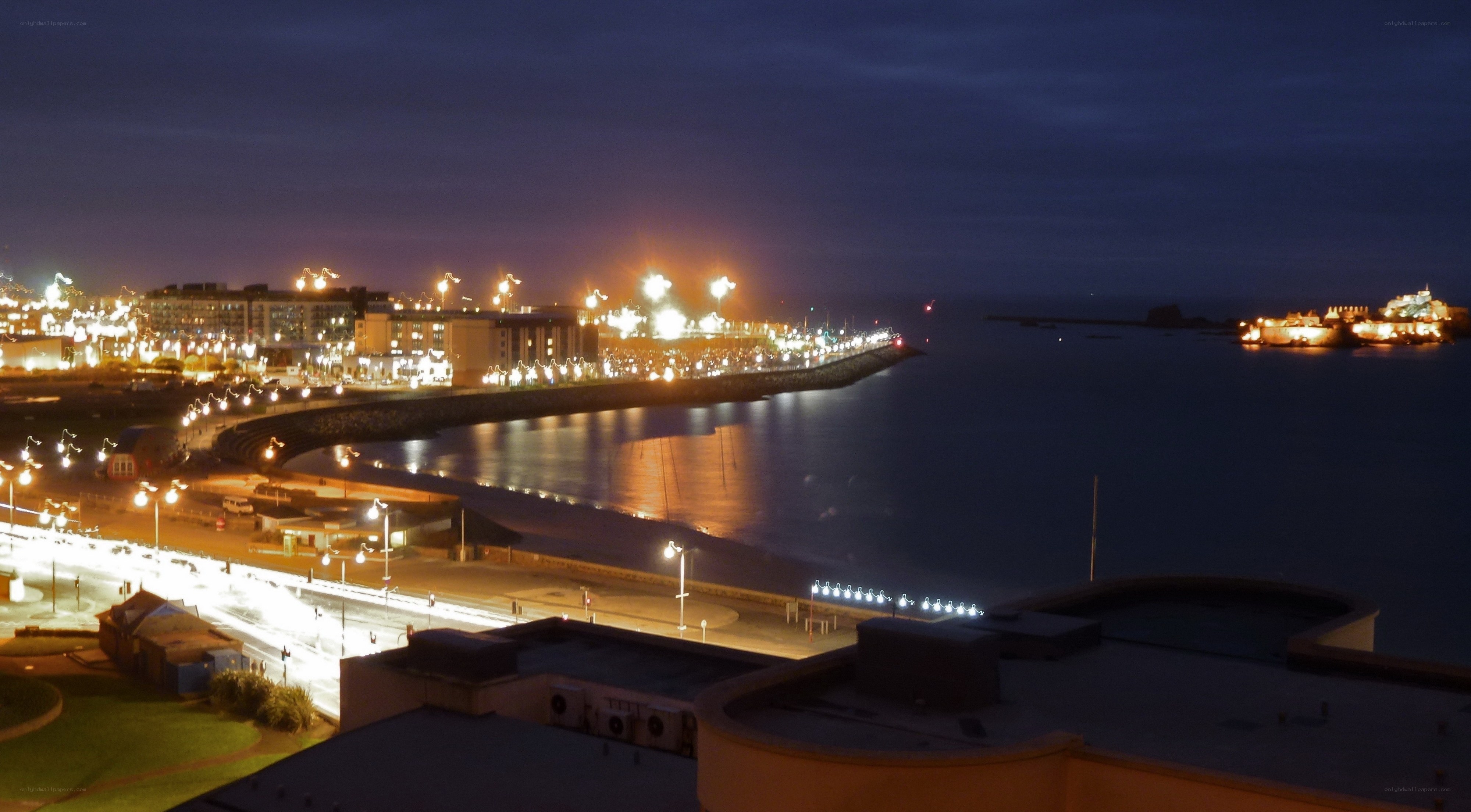 nighttime coastal city view