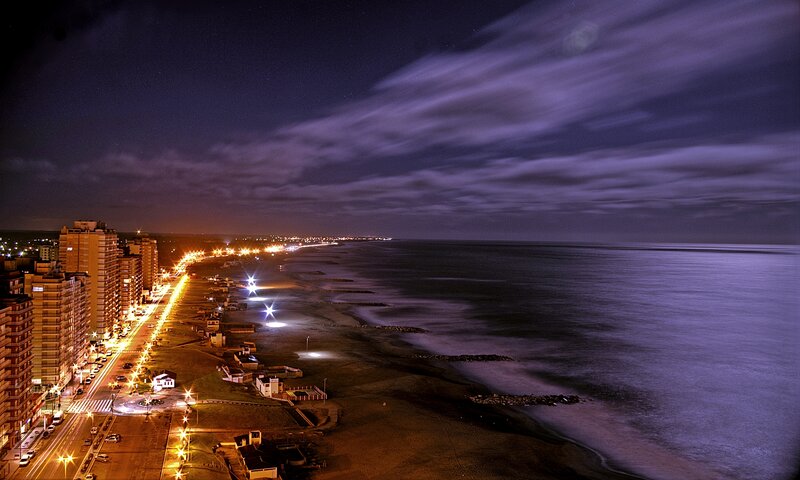 Nighttime Coastal Cityscape — Purple