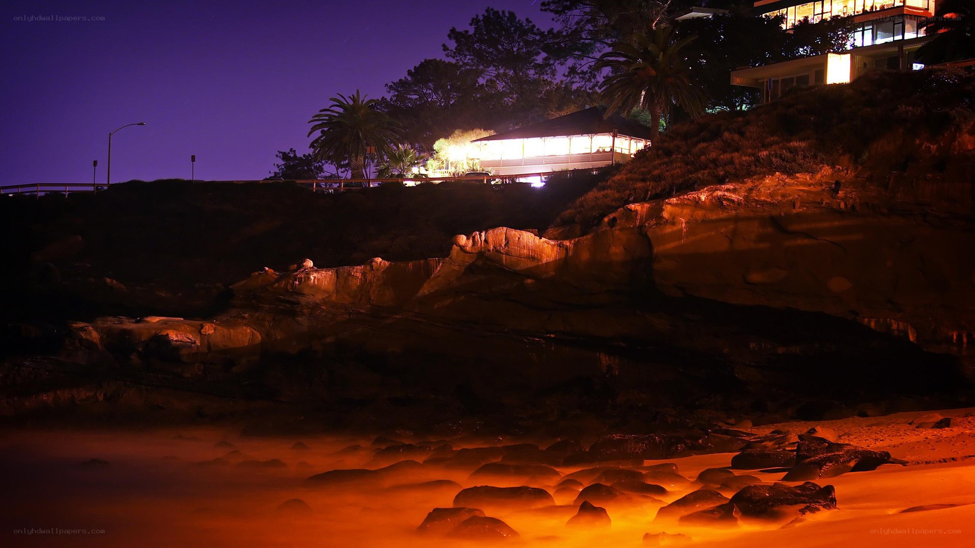 nighttime coastal cliff scene