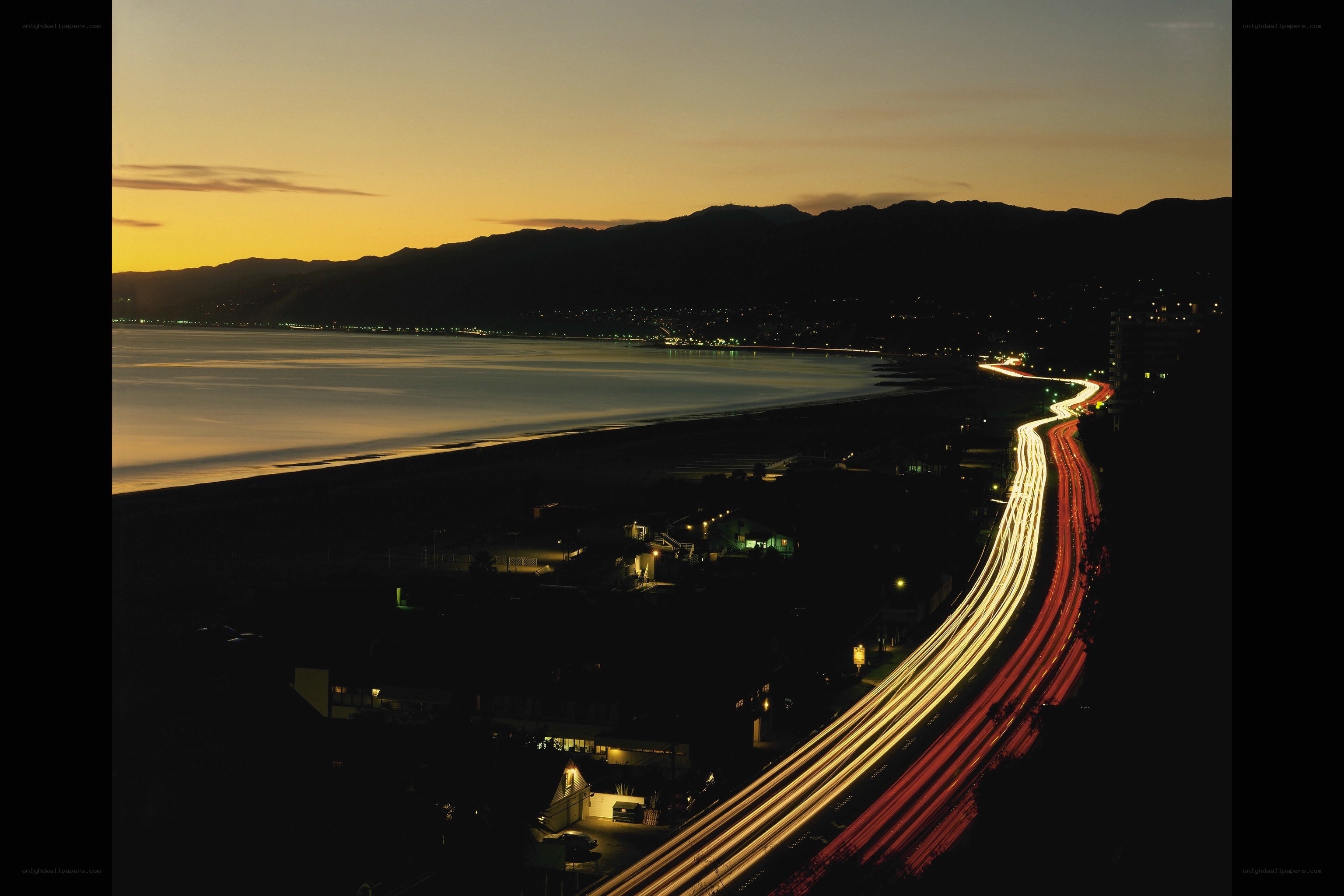 Nighttime coastal highway scene