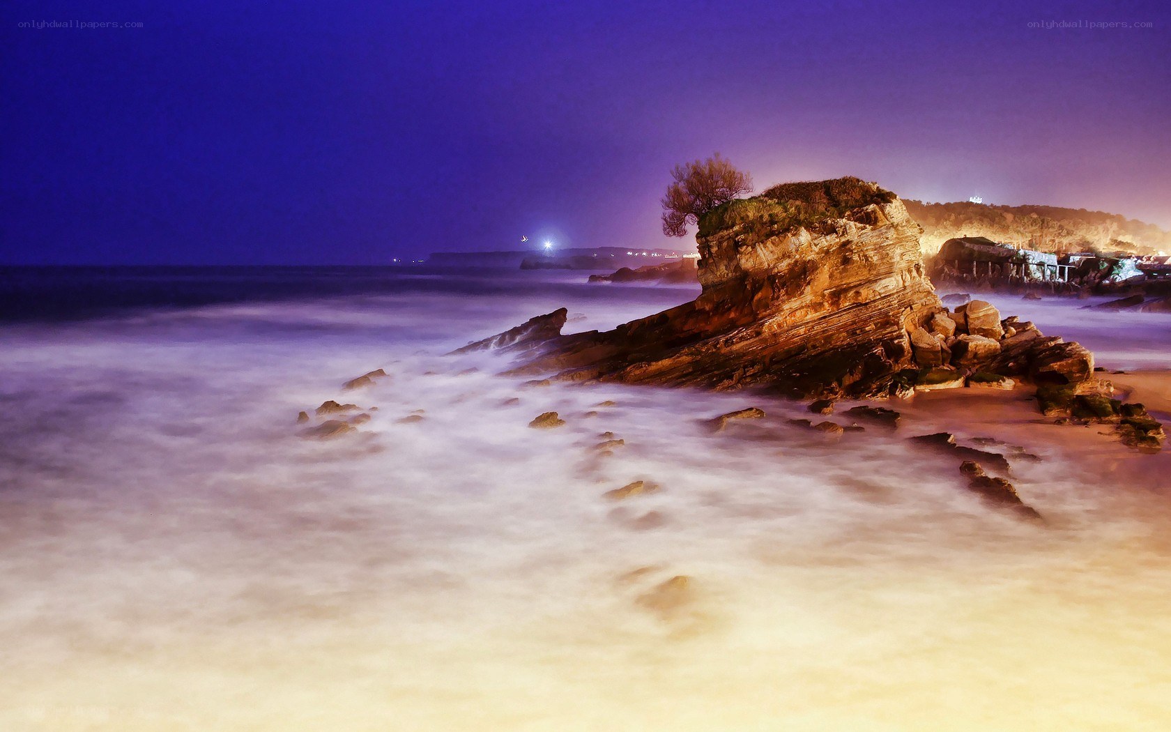 Nighttime coastal rock formation