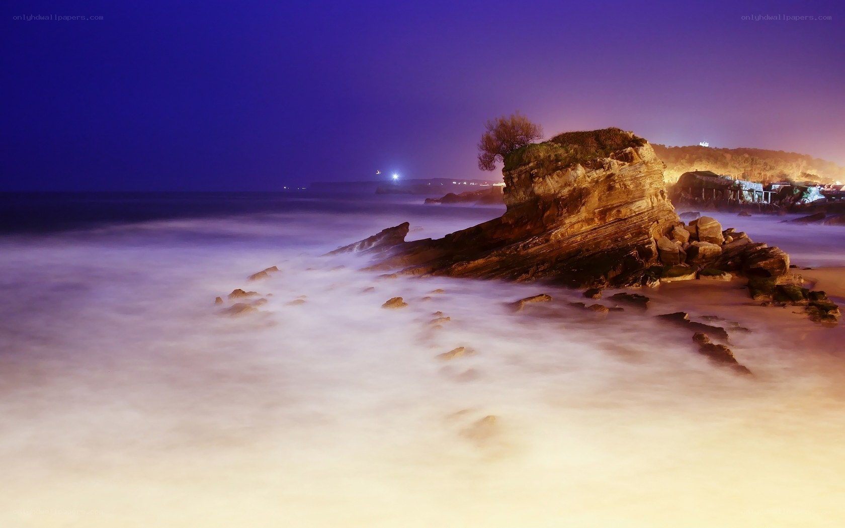 Nighttime coastal rock formation