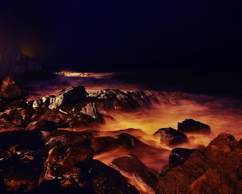 nighttime coastal rocks