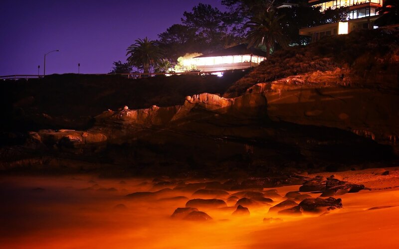 nighttime coastal scene with houses