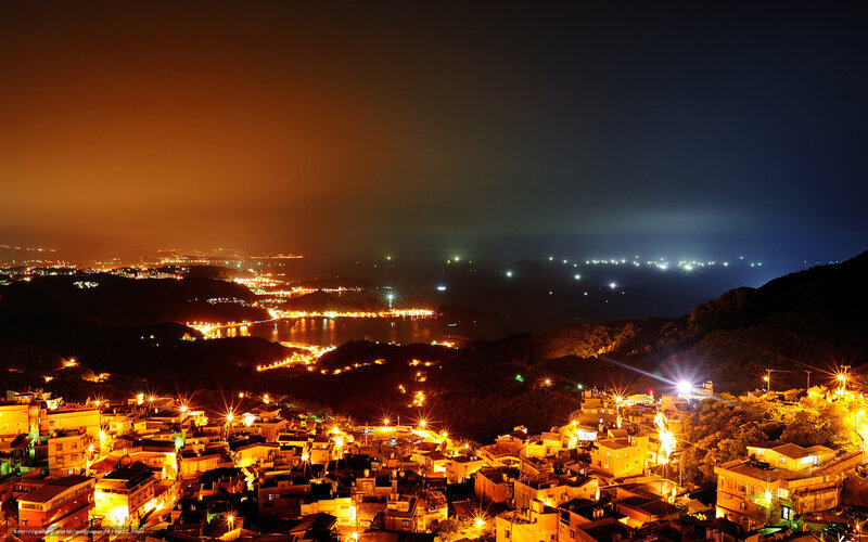 Nighttime Coastal Town — Orange