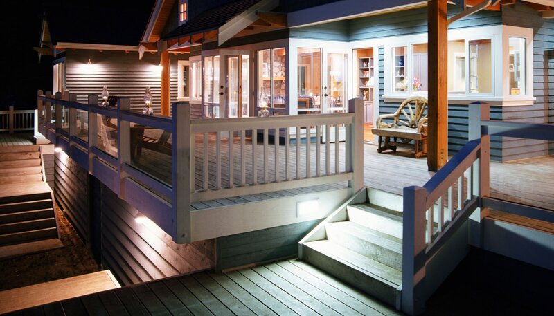nighttime deck with outdoor lighting