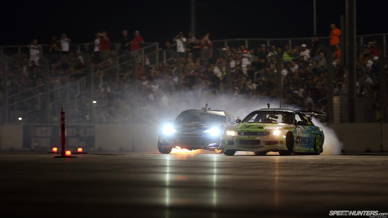 Nighttime drift race with spectators
