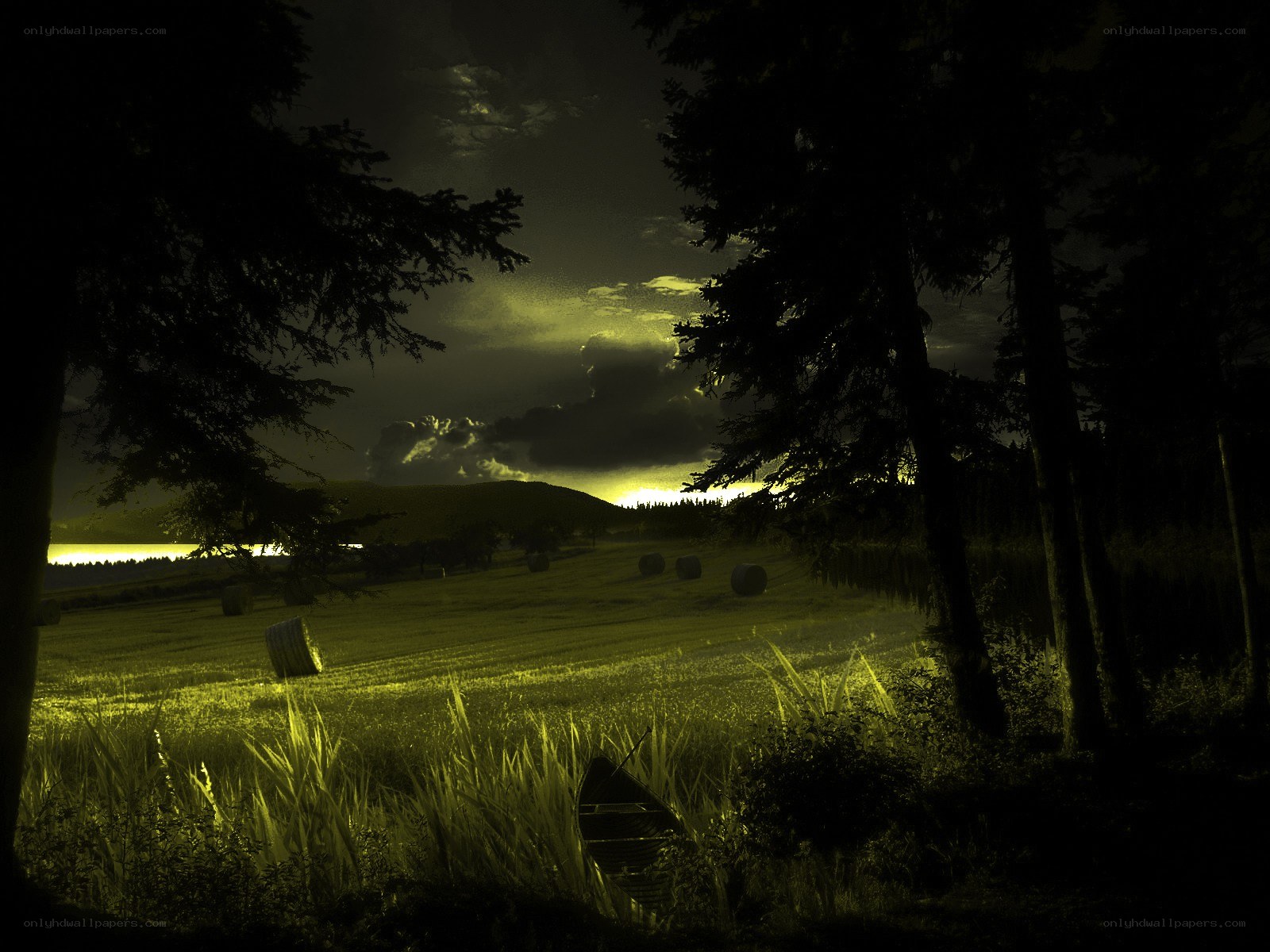 Nighttime field with hay bales