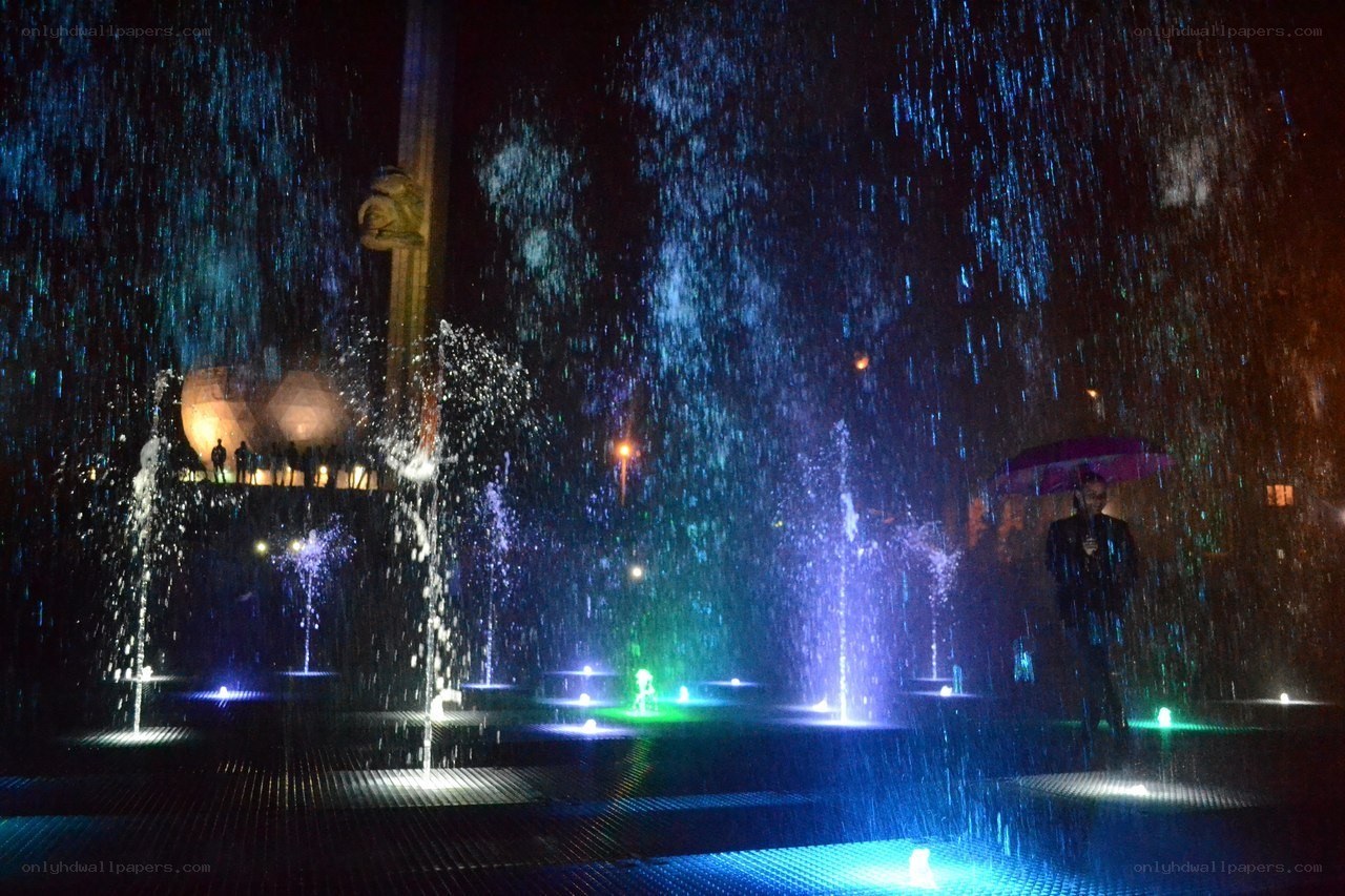 Nighttime fountain display with lights