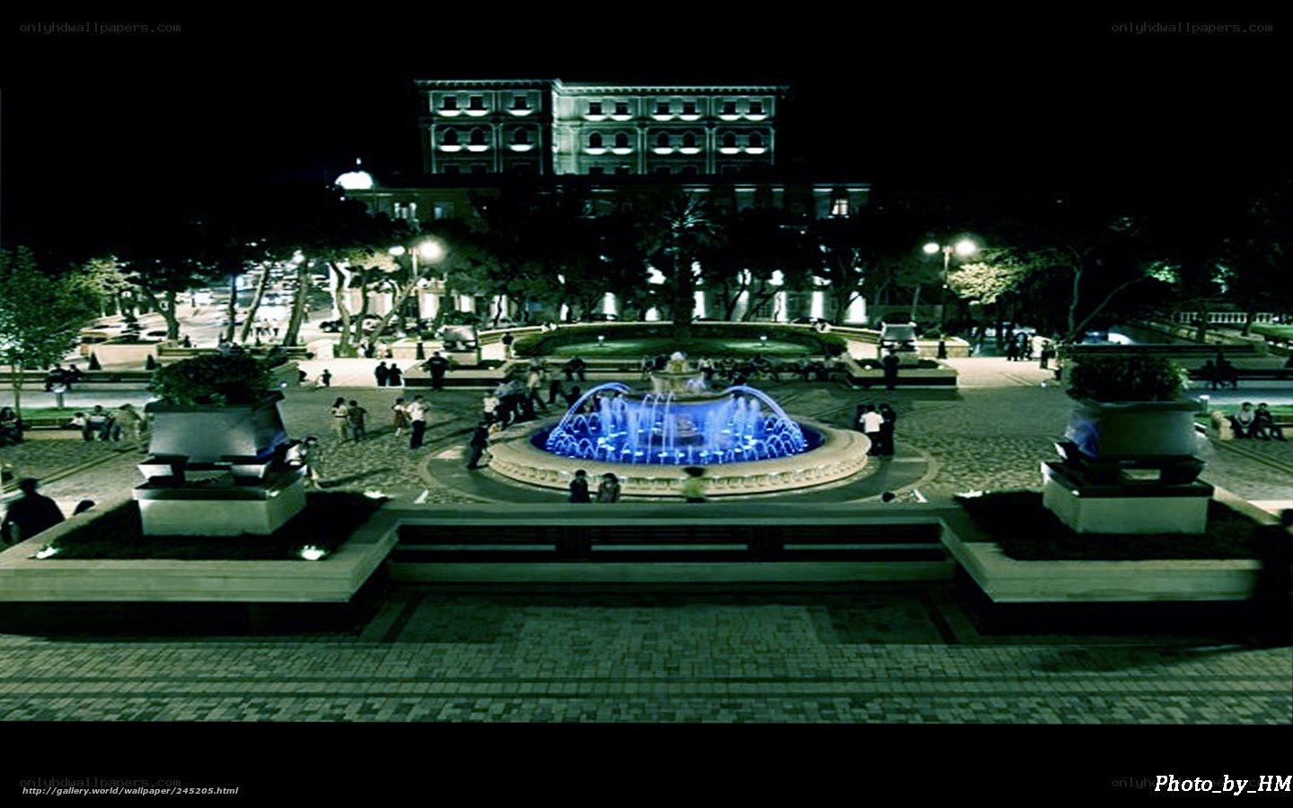 Nighttime fountain in city square