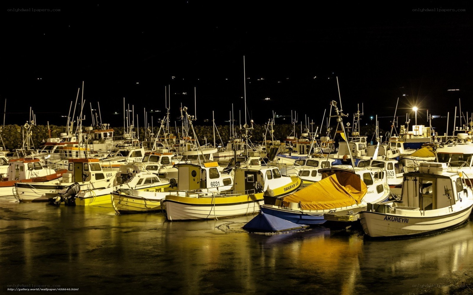 Nighttime harbor with boats