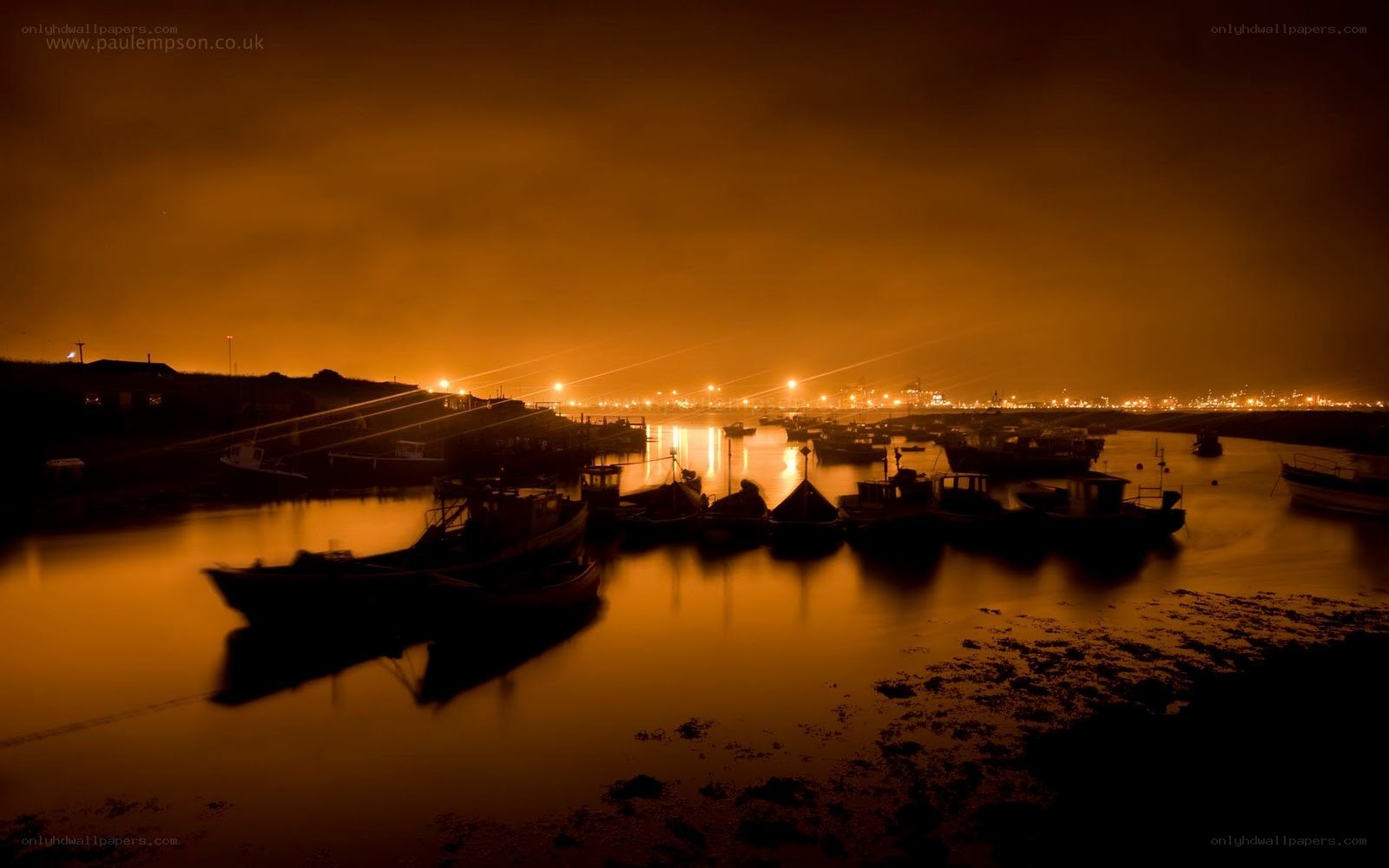Nighttime harbor with boats