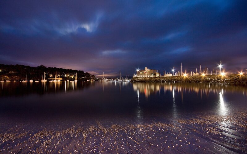 Nighttime harbor with boats