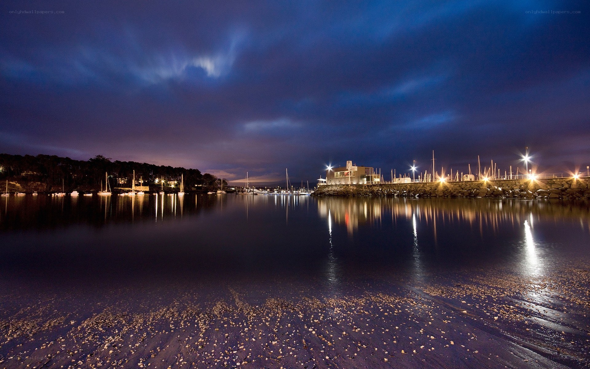 Nighttime harbor with boats