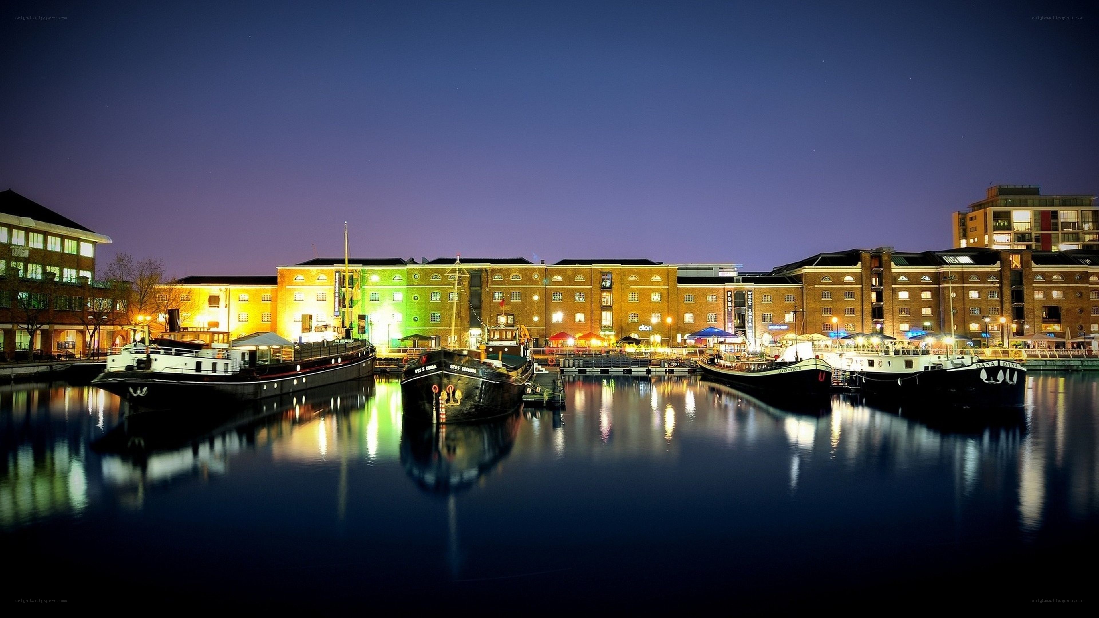 nighttime harbor with boats