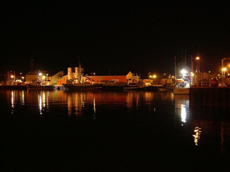 Nighttime harbor with boats