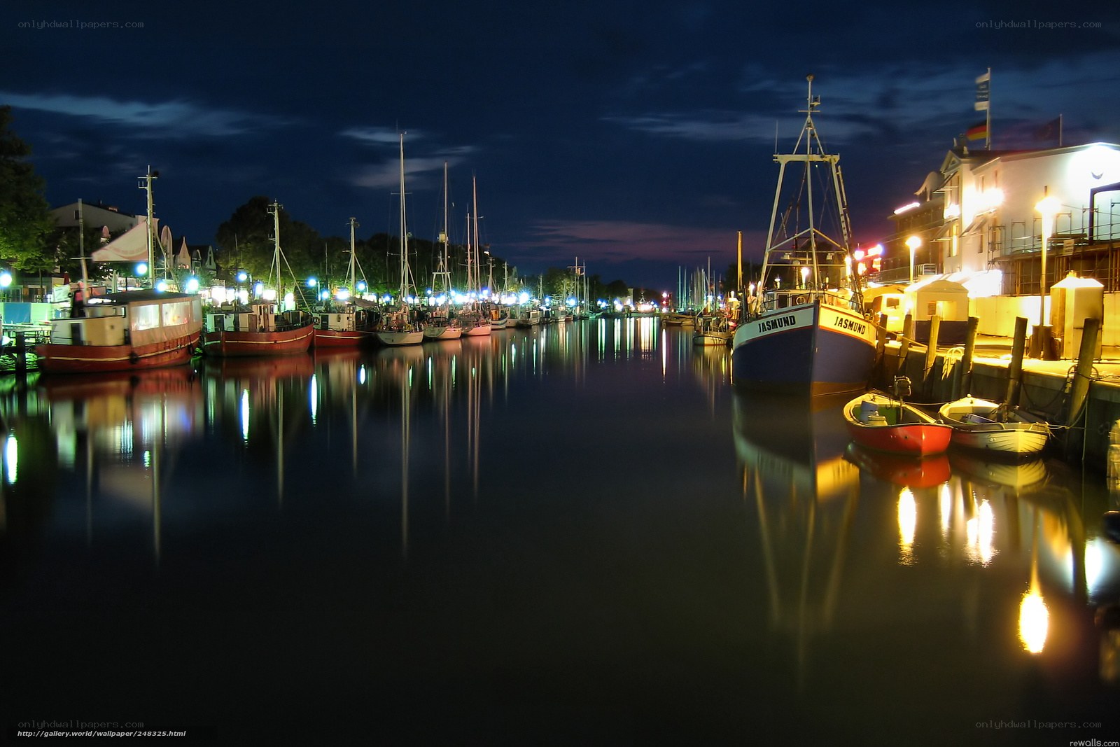Nighttime harbor with boats