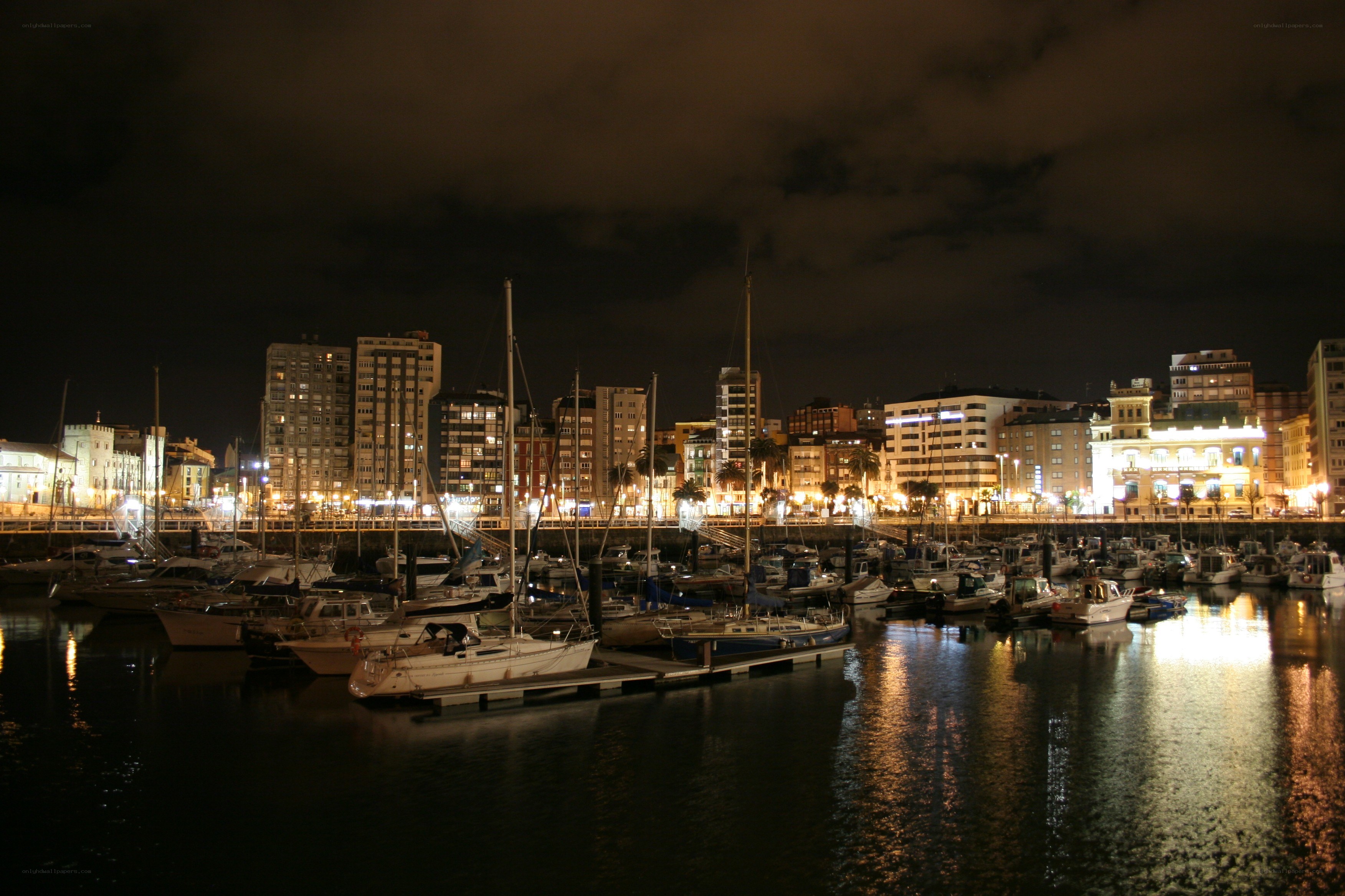 nighttime harbor with city lights