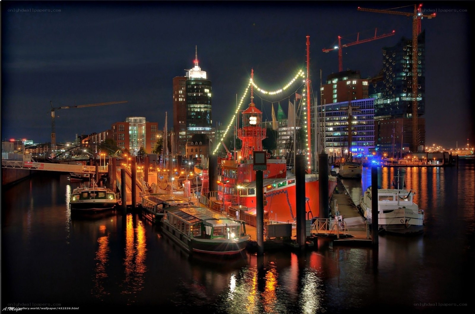 Nighttime harbor with city skyline
