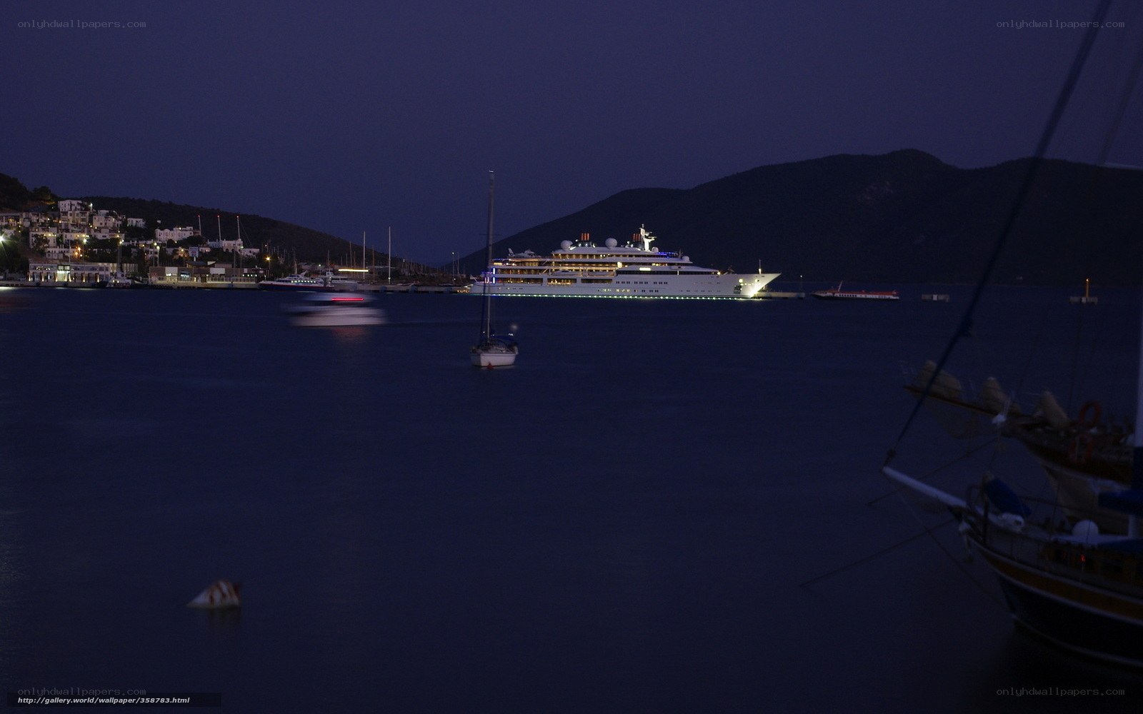 Nighttime harbor with cruise ship