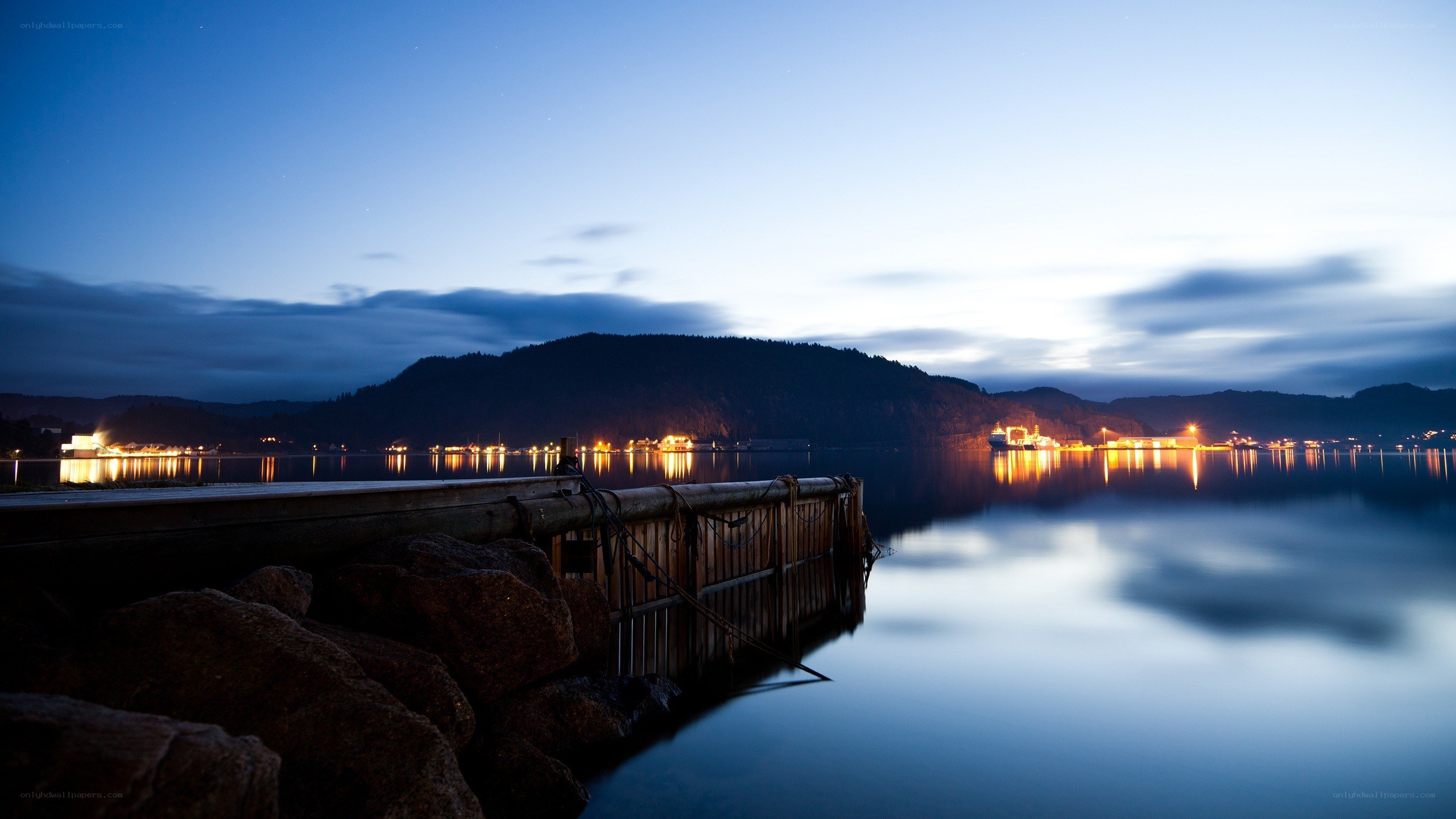 Nighttime harbor with dock and lights