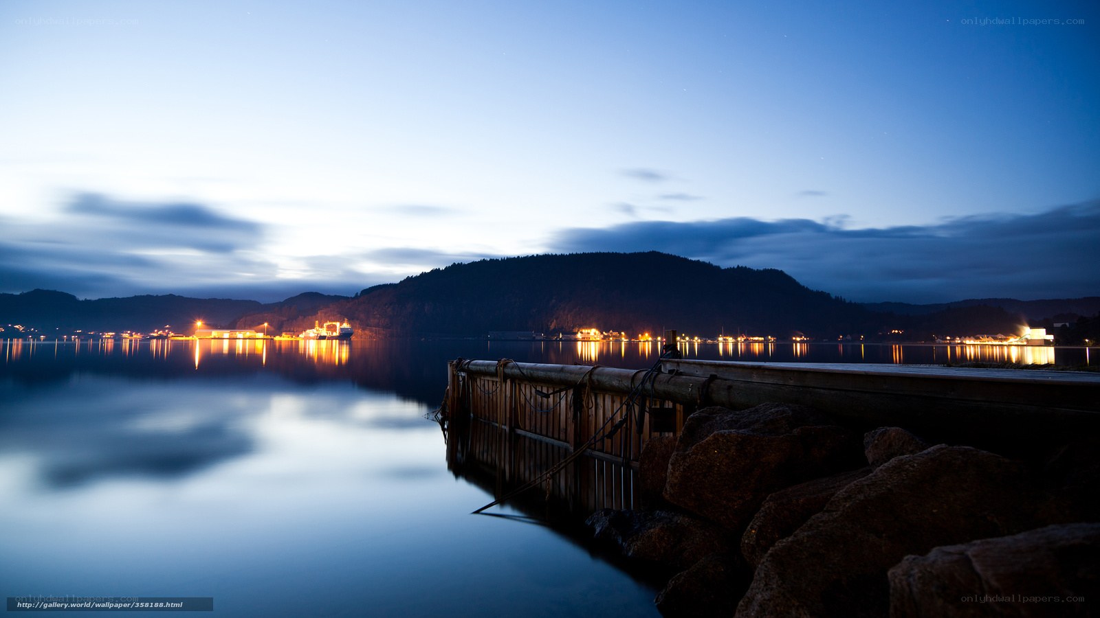Nighttime harbor with dock and lights