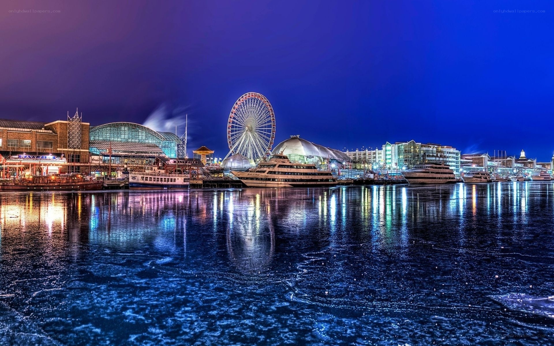 Nighttime harbor with Ferris wheel