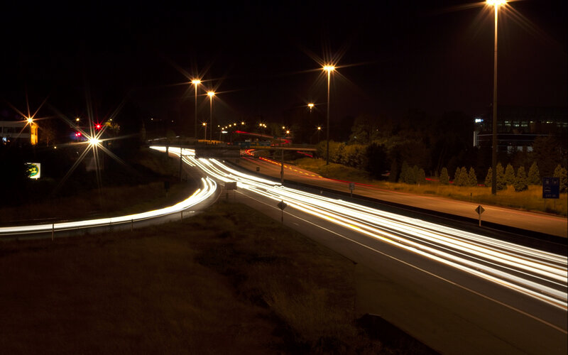 Nighttime highway traffic trails