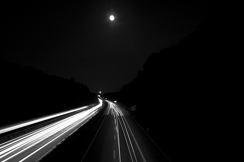 Nighttime highway under moonlight