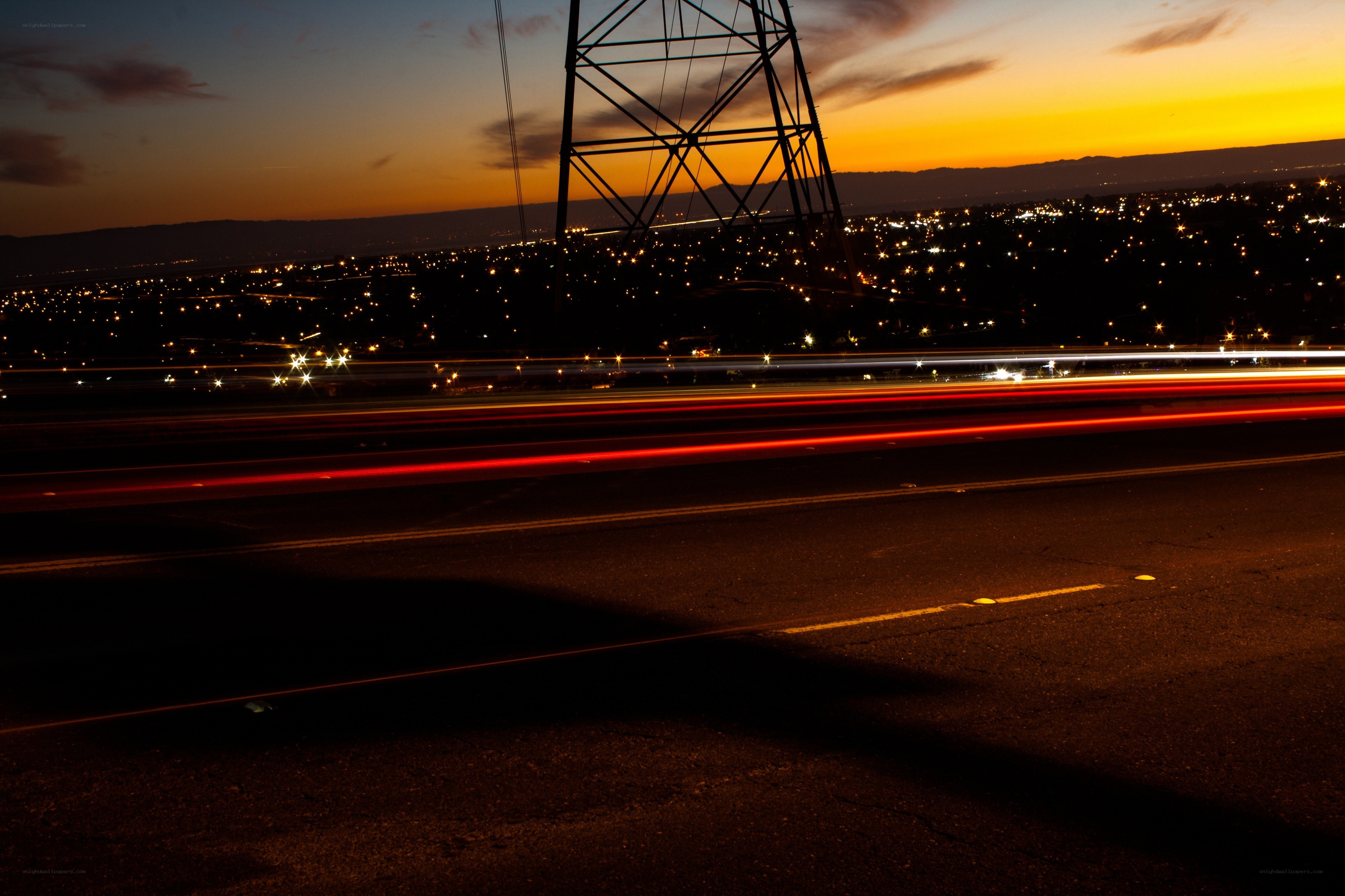 Nighttime highway with light trails
