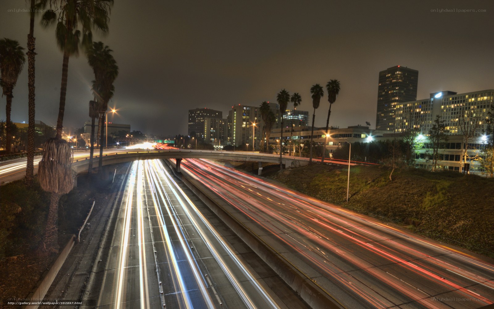 Nighttime highway with light trails