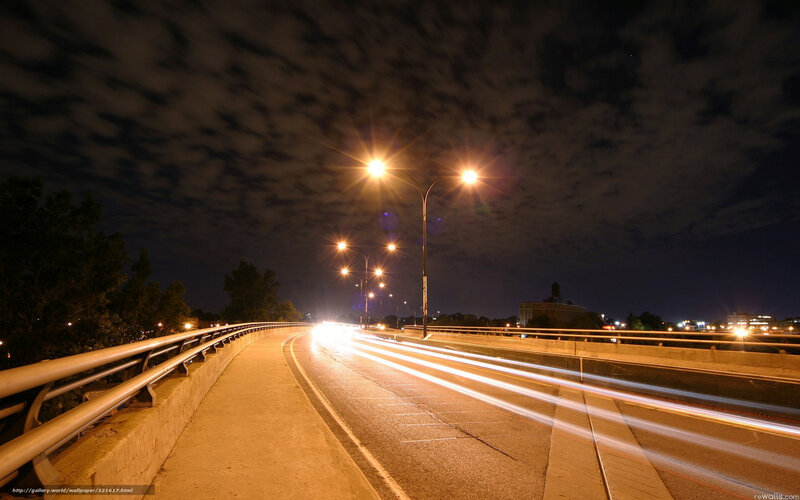 Nighttime highway with light trails