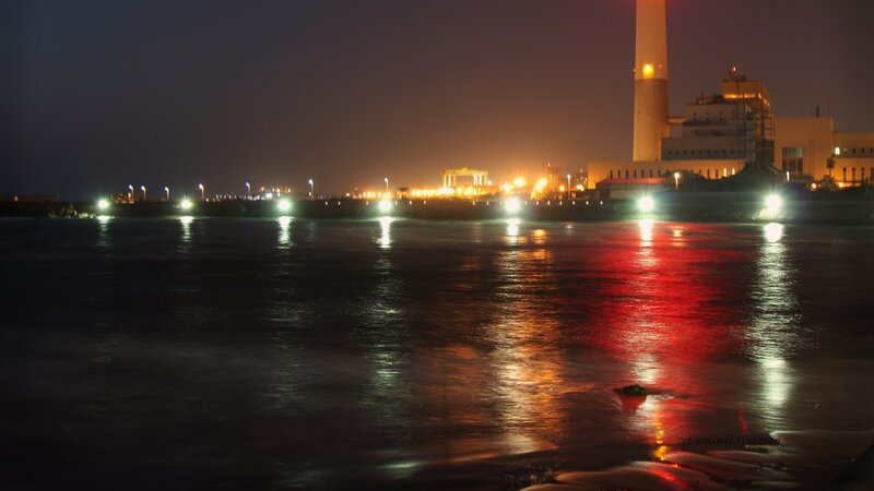 nighttime industrial waterfront