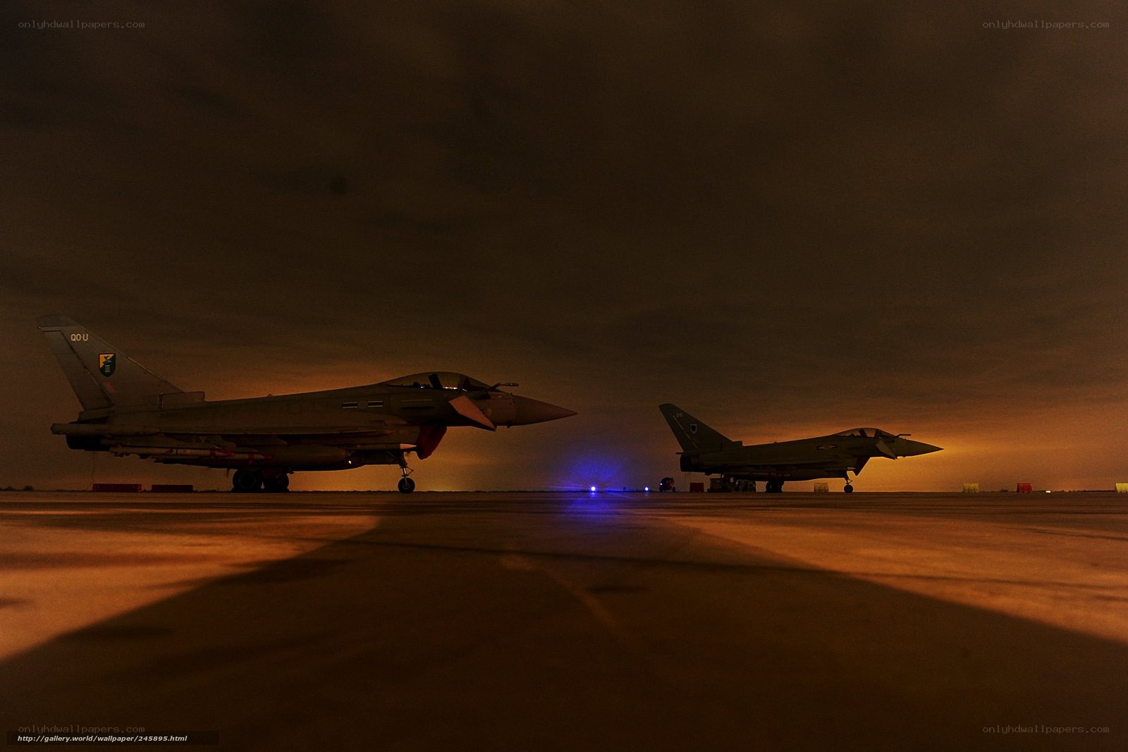 Nighttime jet aircraft on tarmac