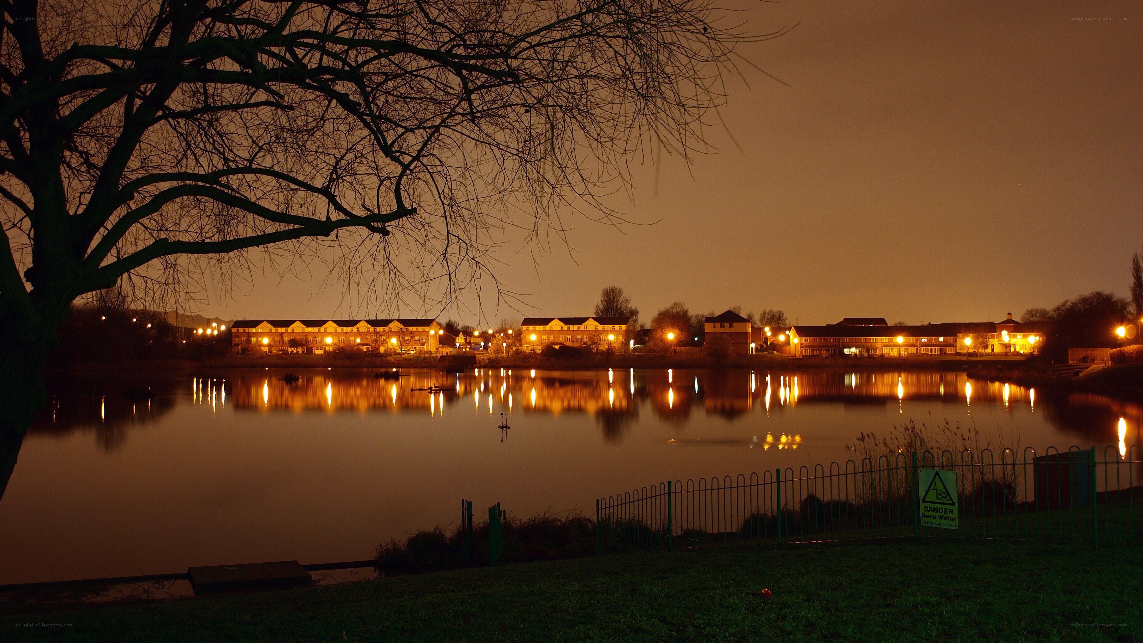 nighttime lake view with buildings