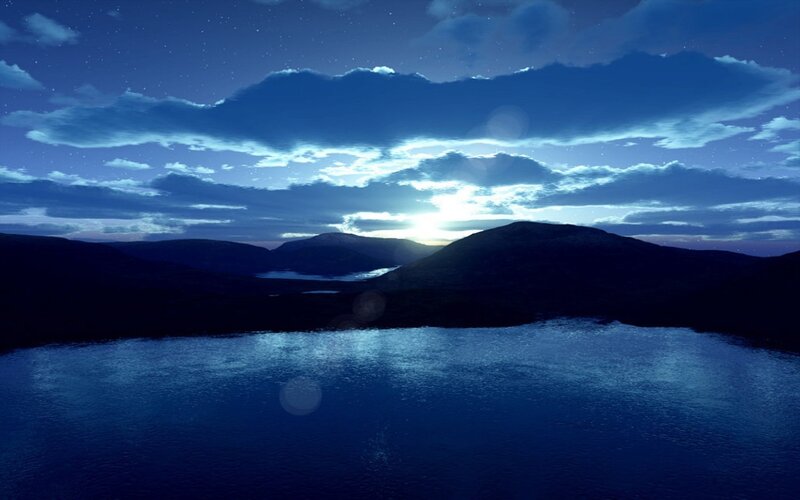 nighttime lake with mountains