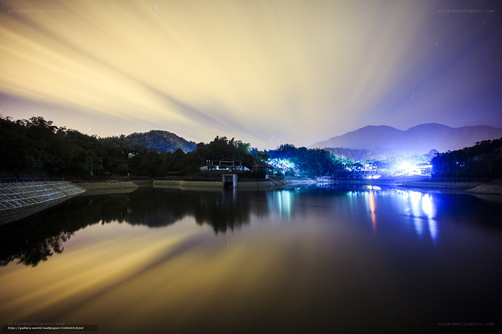 Nighttime lake with star trails