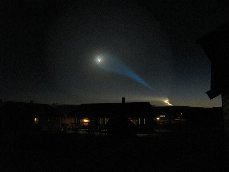 Nighttime light display over houses