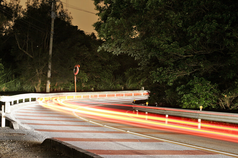 Nighttime light trails on a winding road
