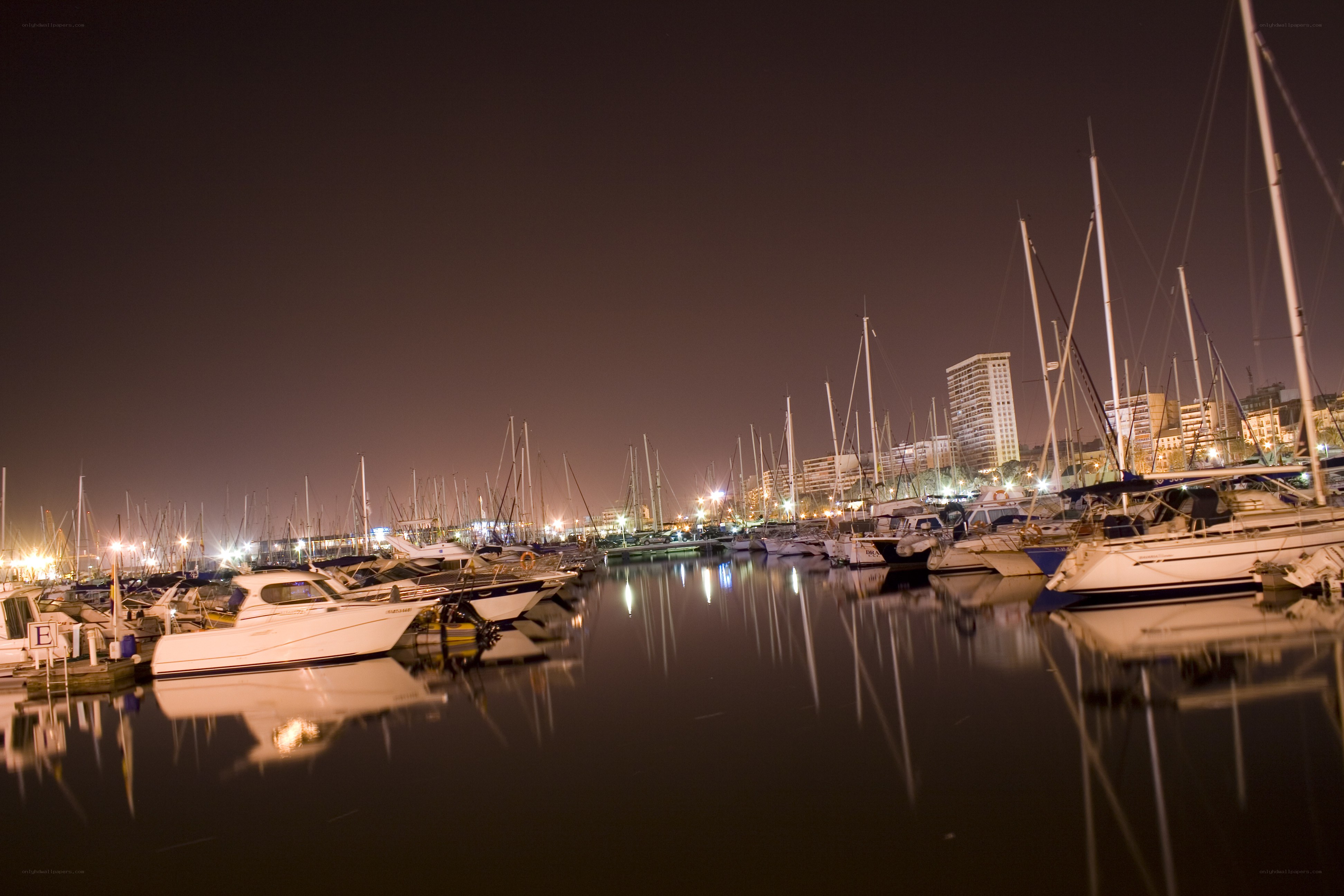 Nighttime marina with boats