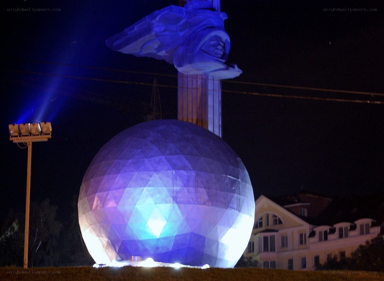 Nighttime monument with illuminated sphere
