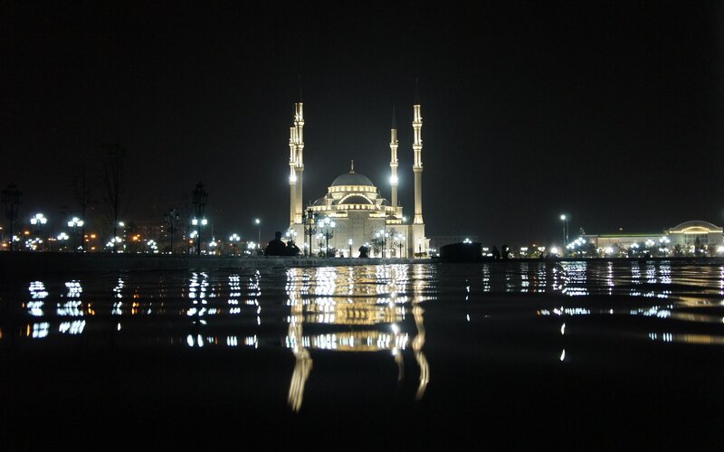 Nighttime mosque reflection