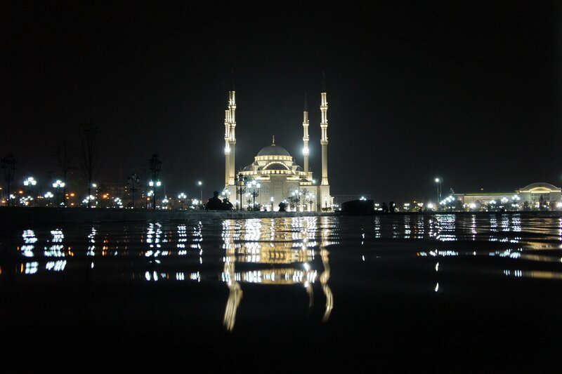 Nighttime mosque with reflections