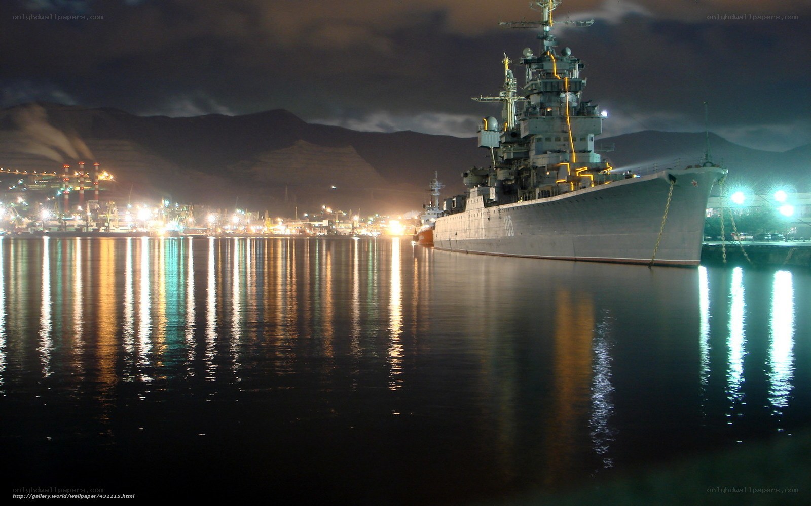Nighttime naval ship in port