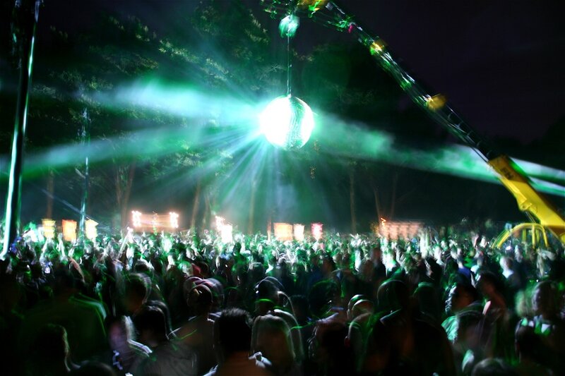 Nighttime outdoor concert with disco ball