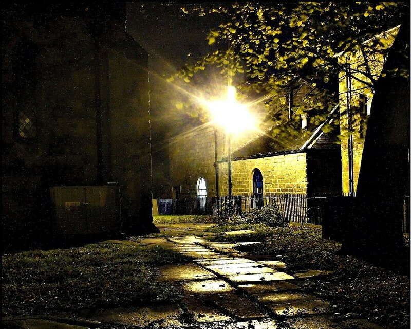 nighttime path to stone building